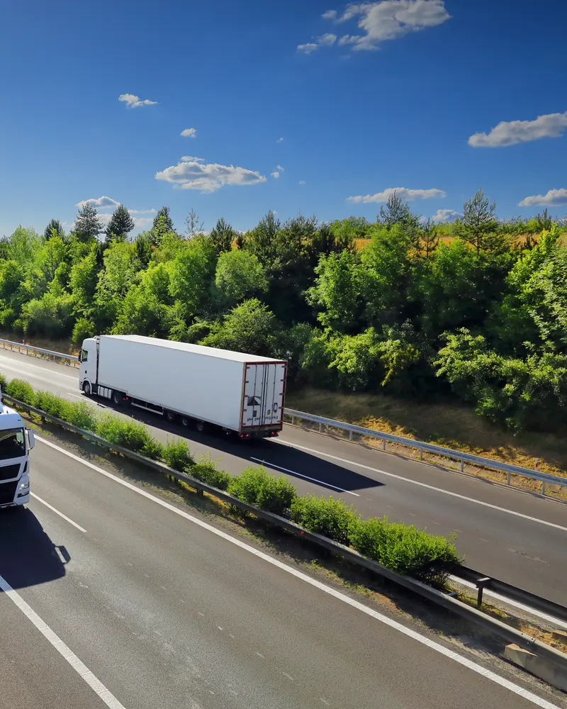 Lorries on a UK dual carriageway — diesel engine parts despatched UK-wide
