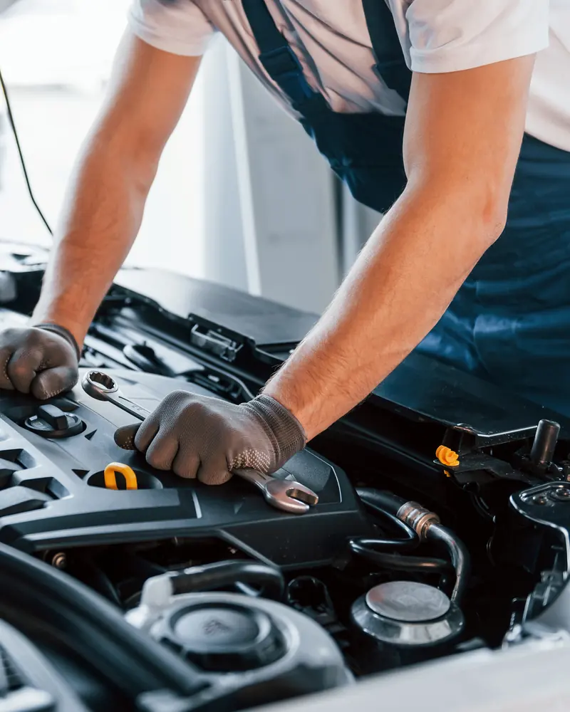 Technician checking a newly fitted engine